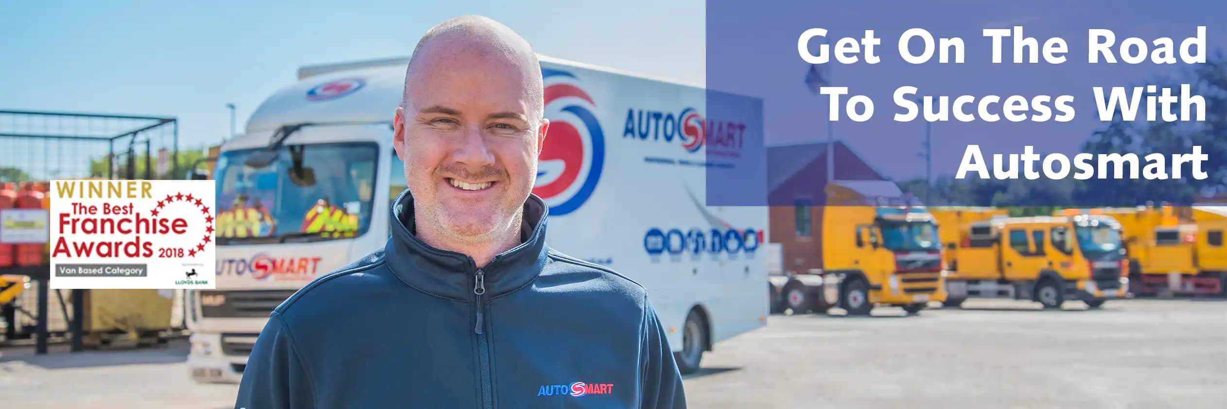 Autosmart franchise owner standing in front of branded van