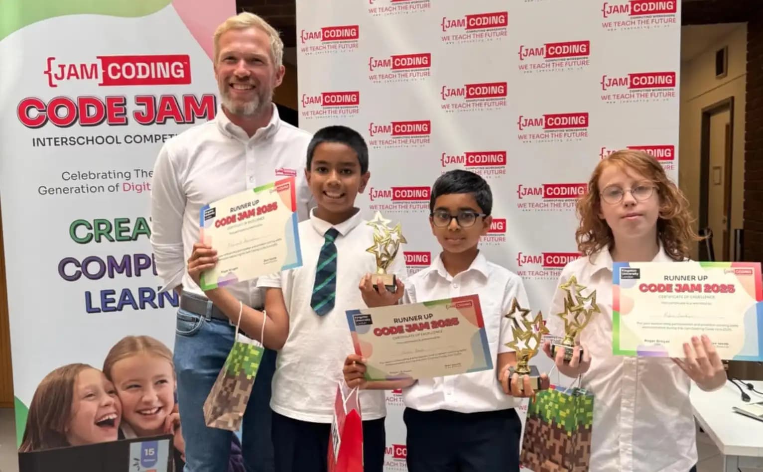 Children celebrating success at a Jam Coding Franchise Code Jam event holding certificates and trophies