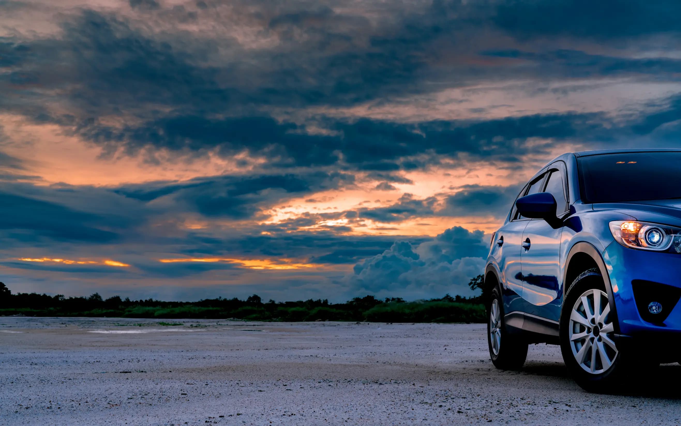 Automotive franchise opportunities in the UK represented by a modern SUV car against a scenic landscape