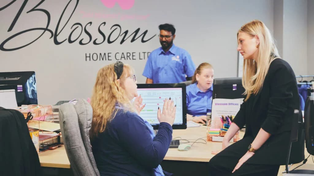 Blossom Home Care franchise office team discussing operations