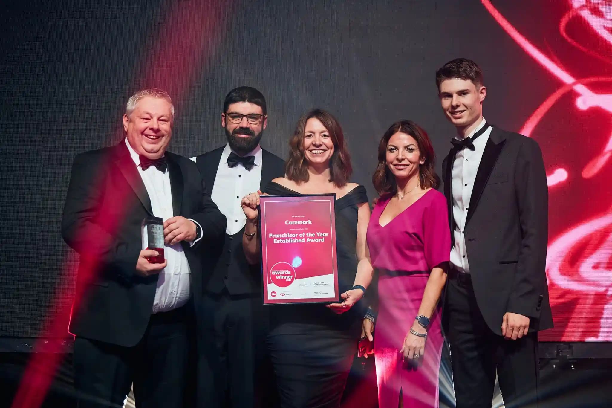 Caremark team receiving the Gold Franchisor of the Year 2025 award