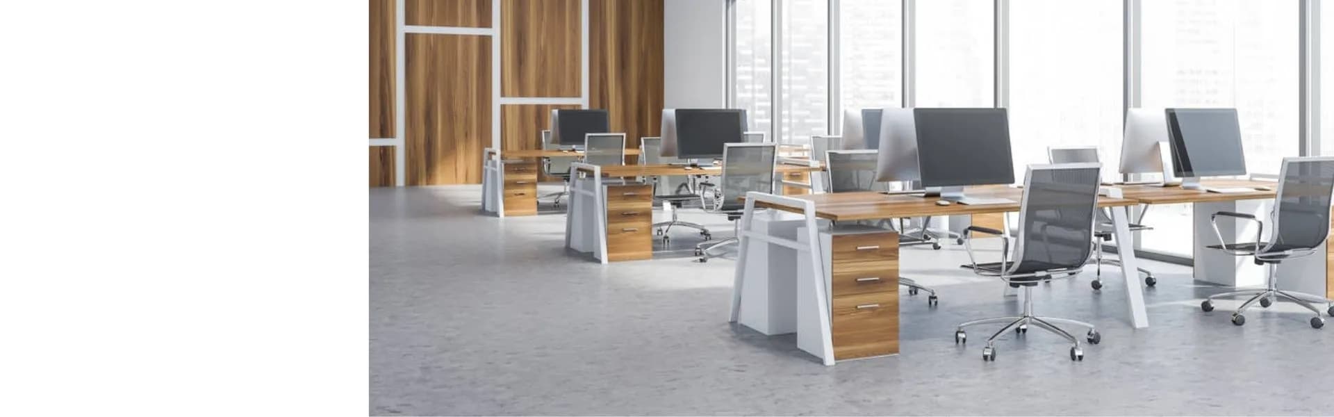 Modern open-plan office interior with wooden desks, computer monitors, ergonomic chairs and large windows, representing office-based franchise opportunities in the UK.