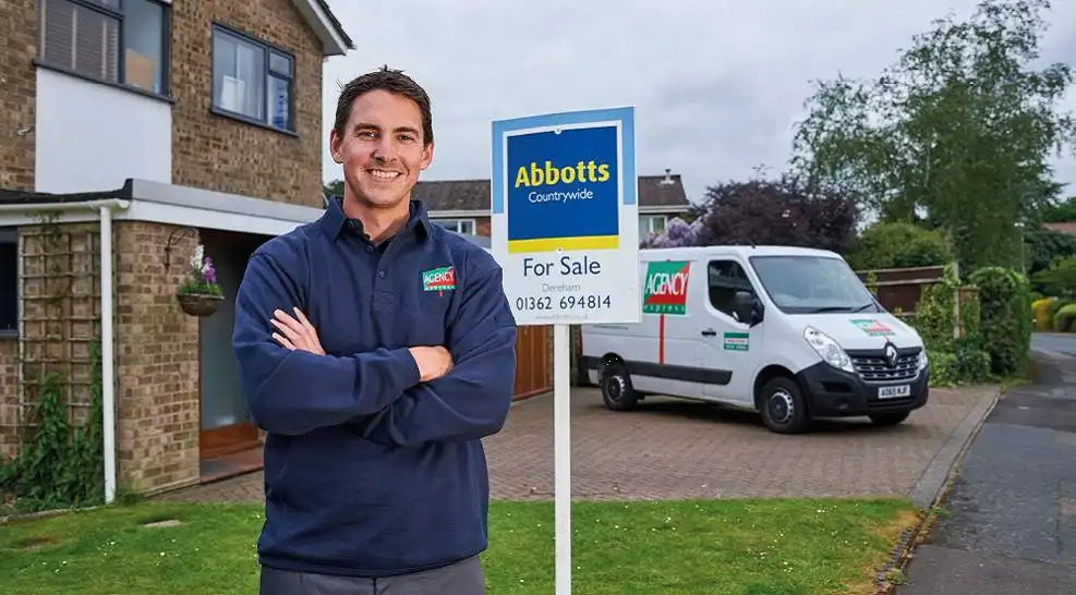 Agency Express Franchise operator installing estate agency for sale board beside branded van