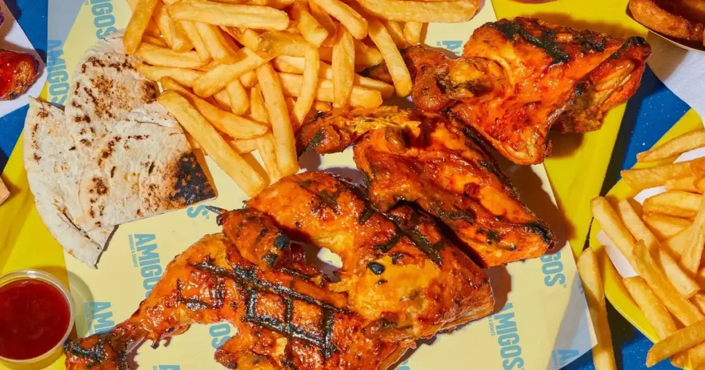Grilled chicken, fries and flatbread served at Amigos Burgers and Shakes Franchise